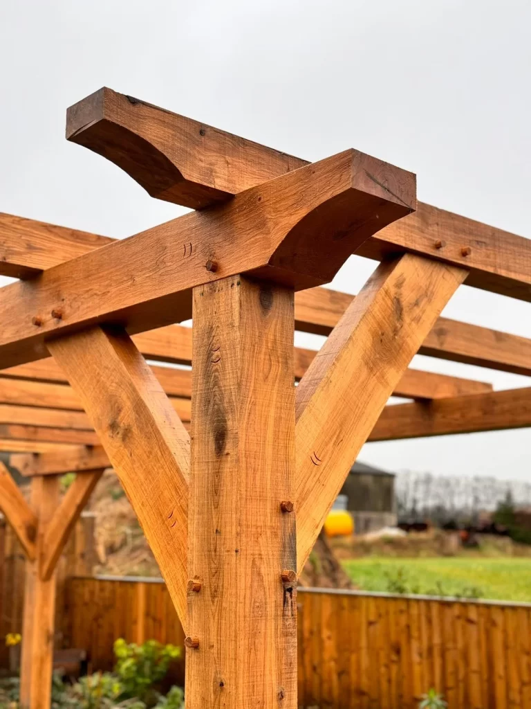 Lovely detail on the corner of this oak framed pergola
